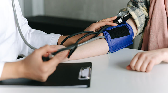 A person getting a blood pressure screening