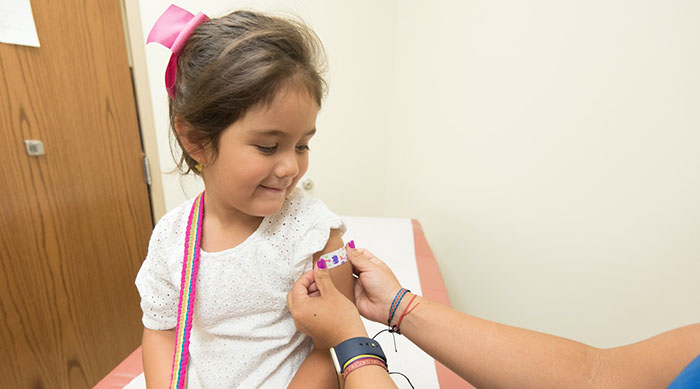 A little girl getting a vaccine